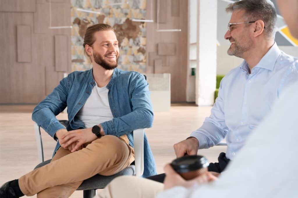 A young man enjoys a group therapy exercise during drug addiction treatment in Philadelphia.