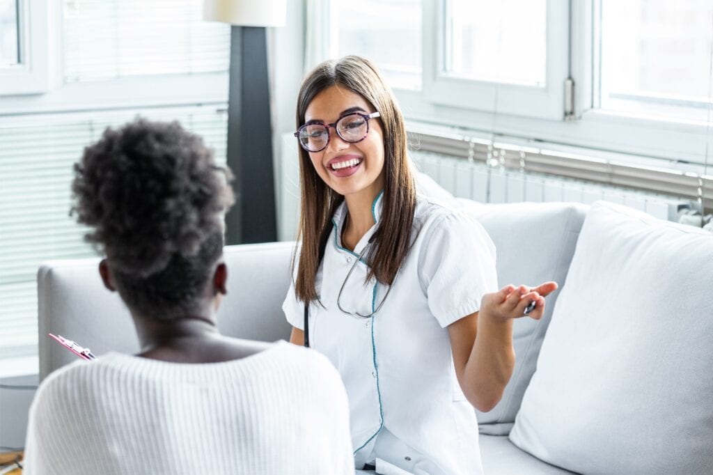 A woman learns about the benefits of detox in Philadelphia during a consultation for recovery treatment.