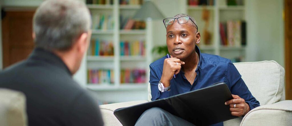 Two people sitting together during a supportive Cognitive-Behavioral Therapy in Philadelphia session