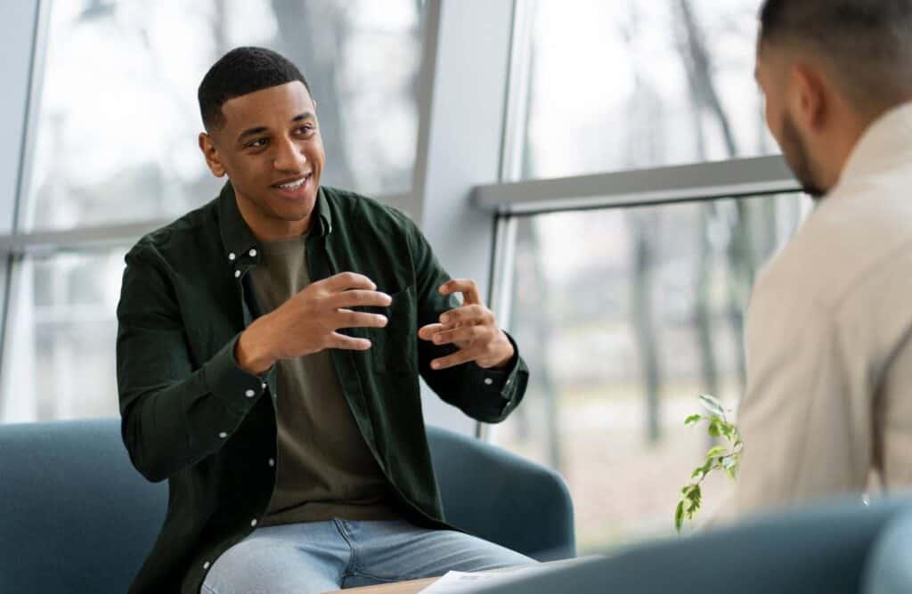 Man speaking with his therapist during trauma-informed care in Philadelphia.