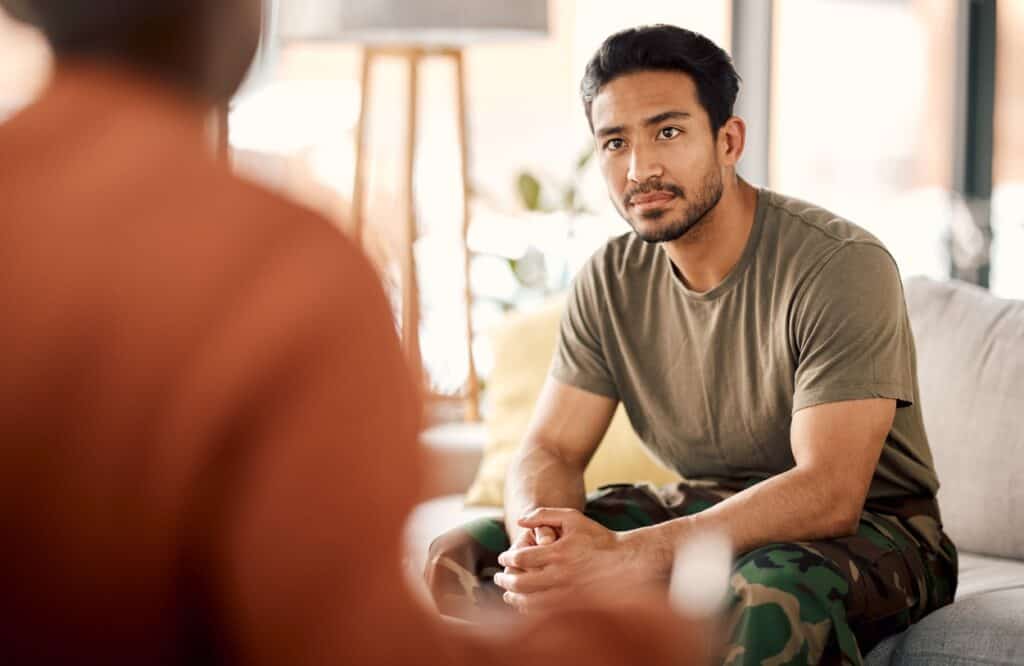 A man talks to his therapist during veterans rehab in Philadelphia.