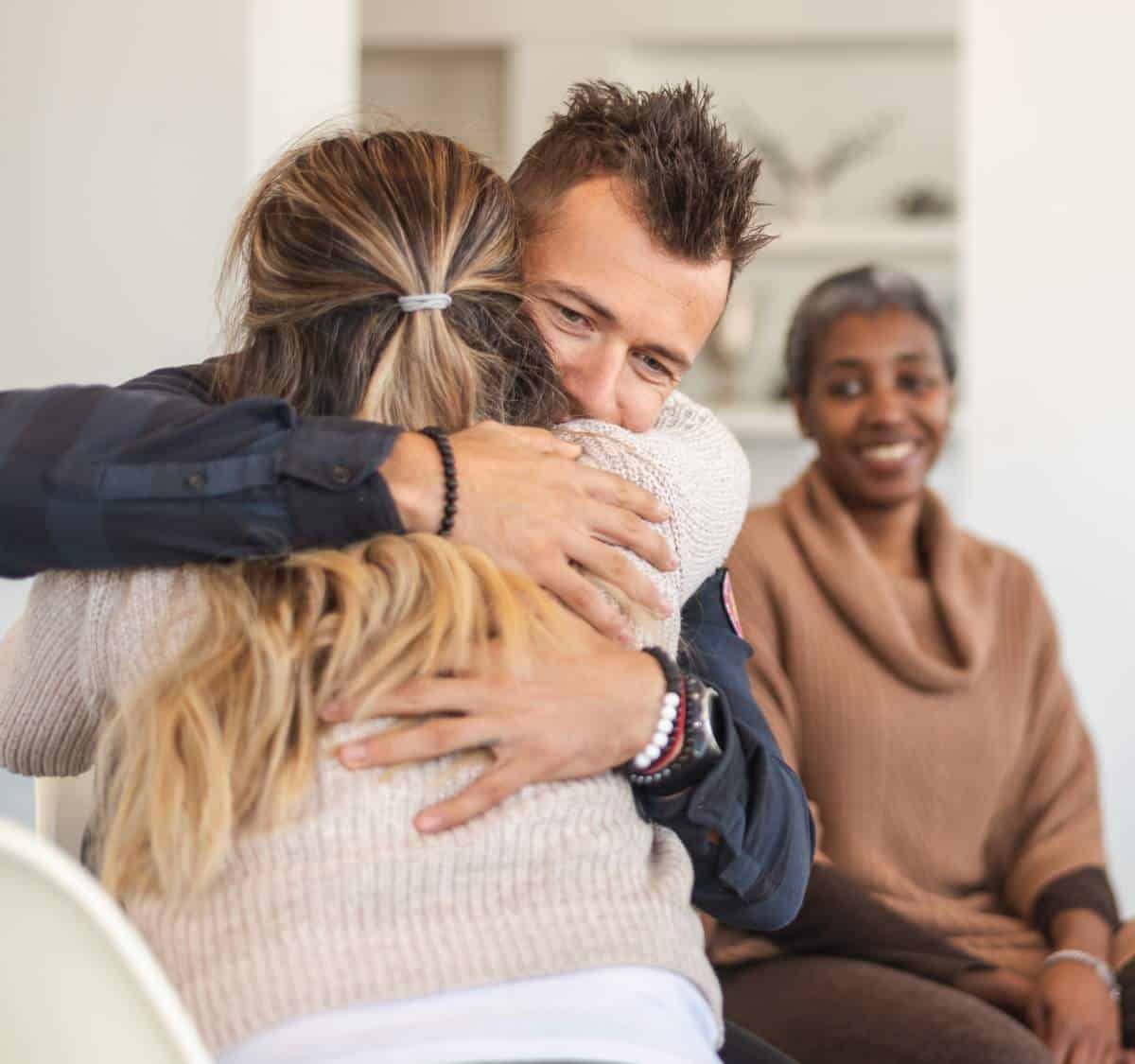 Man reconnecting with family during addiction recovery.