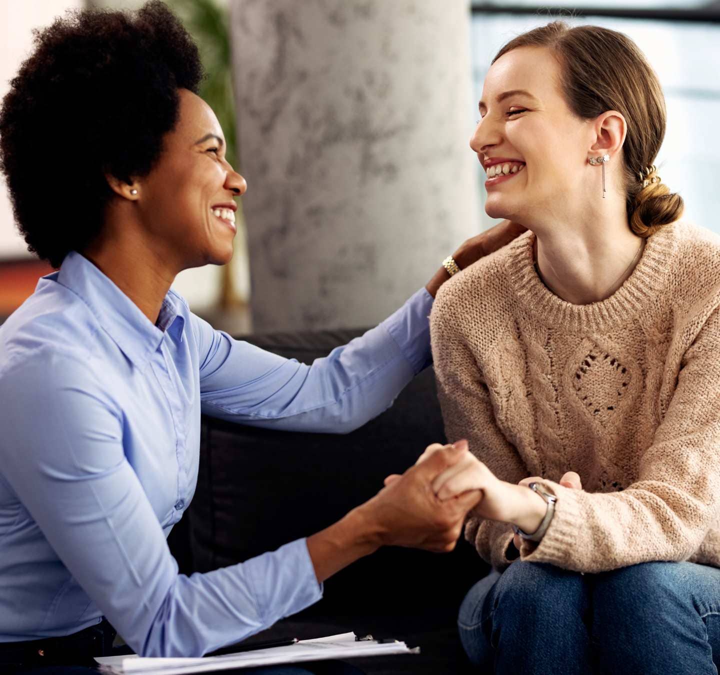 Woman receiving therapeutic support from a counselor.