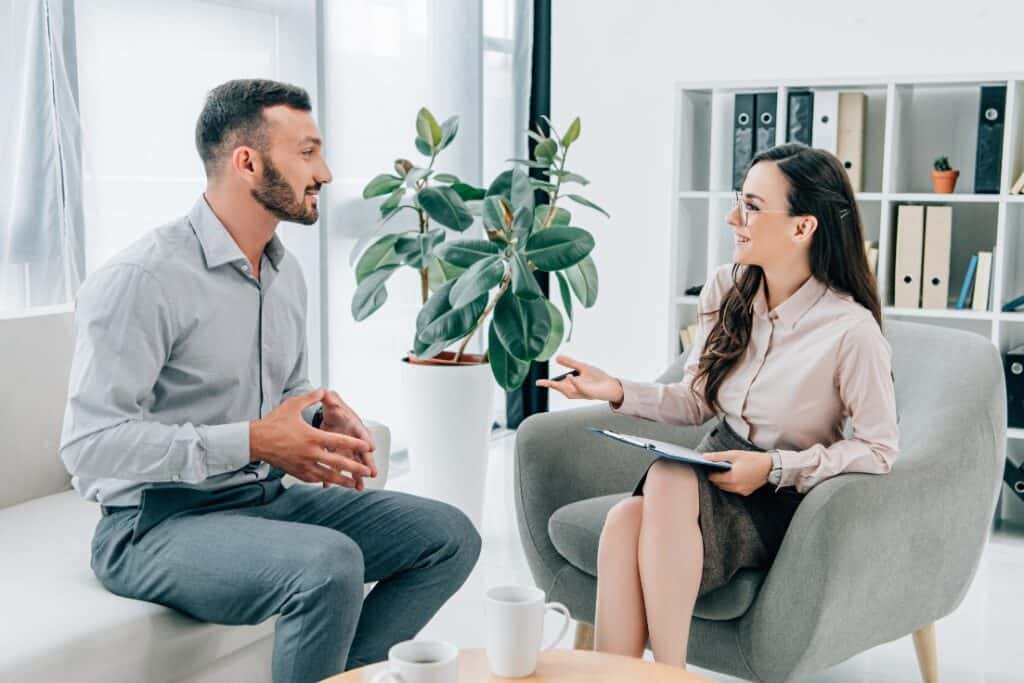 A man enjoys personalized care through CBT therapy and medication management in Philadelphia.