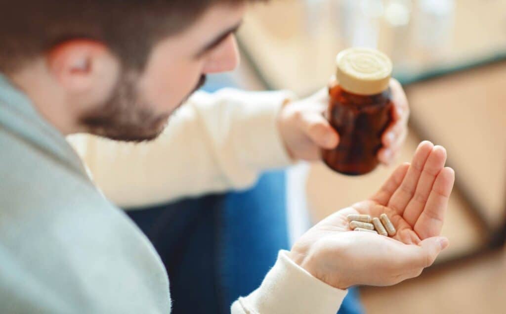 Man struggling with drug misuse and considering Philadelphia prescription drug addiction treatment.