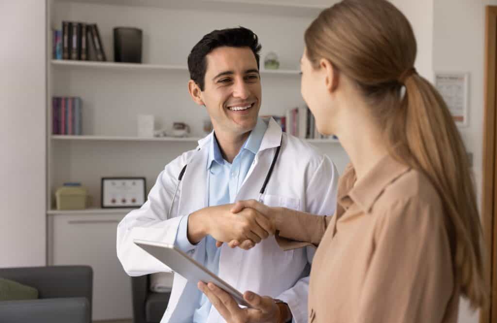 A woman talks to her doctor about rehab near Merion Station, PA.