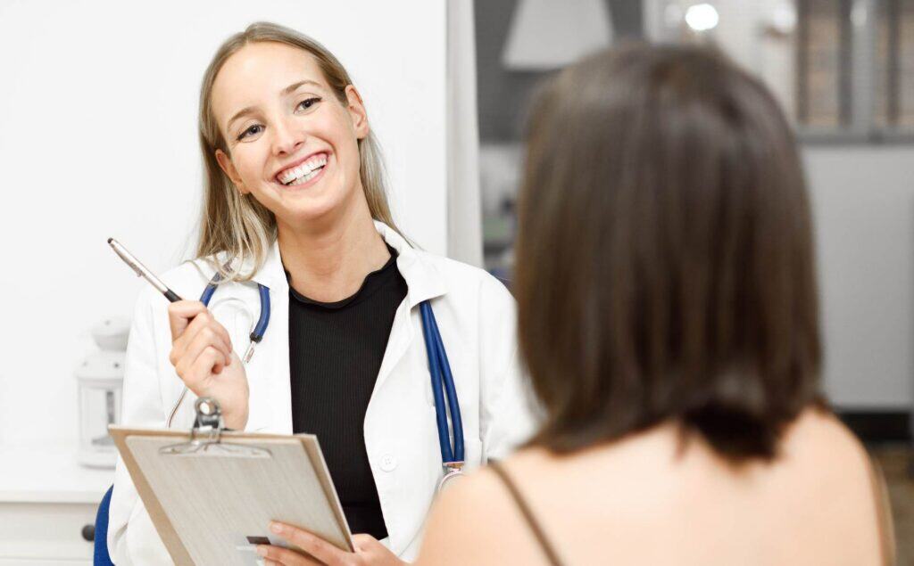 Doctor discussing PHP vs IOP treatment options with a client.