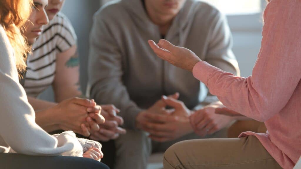 Guided group conversation during trauma-informed addiction treatment.