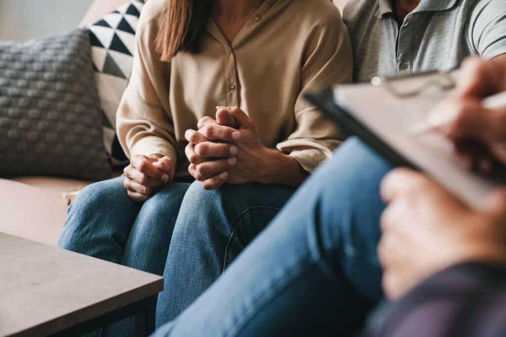 Couple speaking with a psychologist during therapy as part of kratom rehab and addiction recovery support at Recovery Home PA.