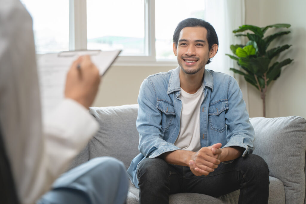 Man seeking mental health treatment while talking to a counsellor