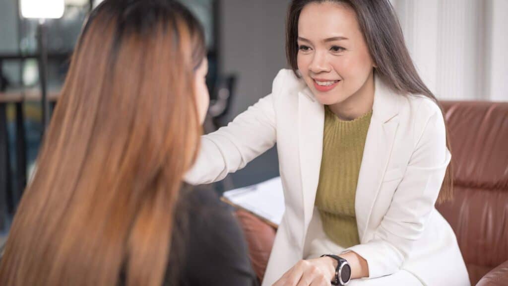 A supportive therapist smiling and talking to a patient during an Ativan Addiction Treatment session in Philadelphia